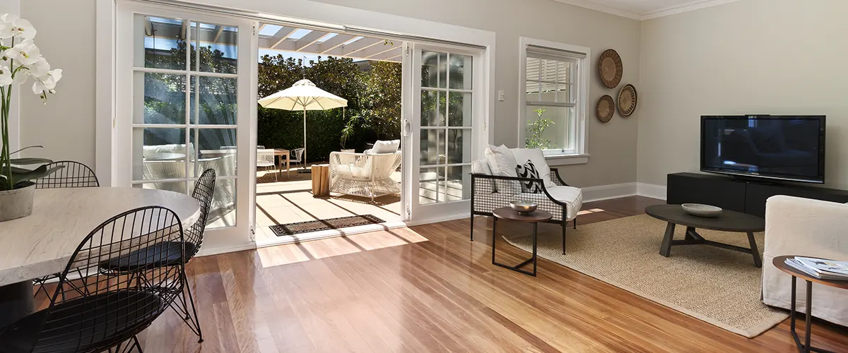 A living room with laminate floor that looks like wood