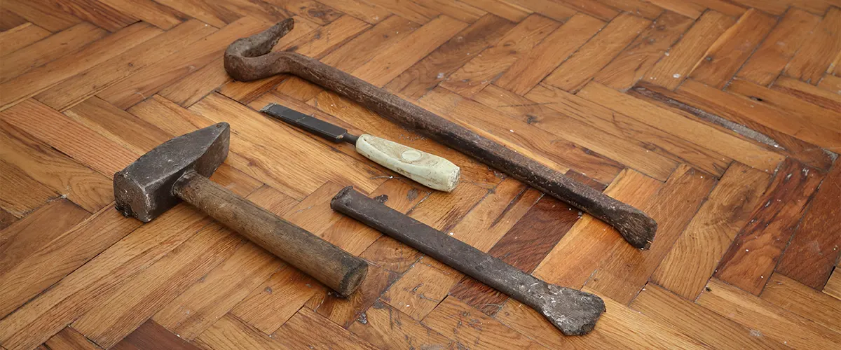 Tools for resurfacing a hardwood floor with a herringbone pattern