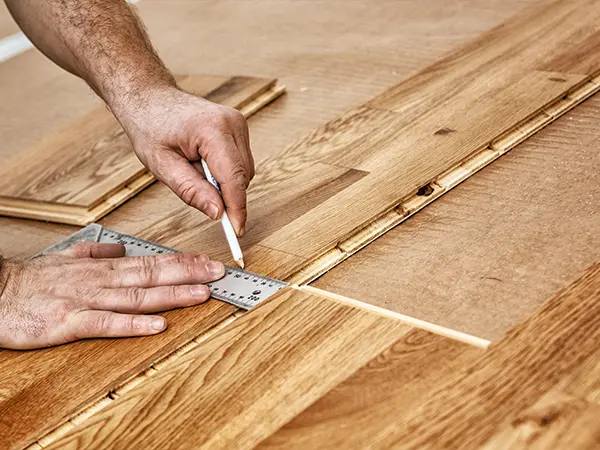 Engineered hardwood flooring being installed