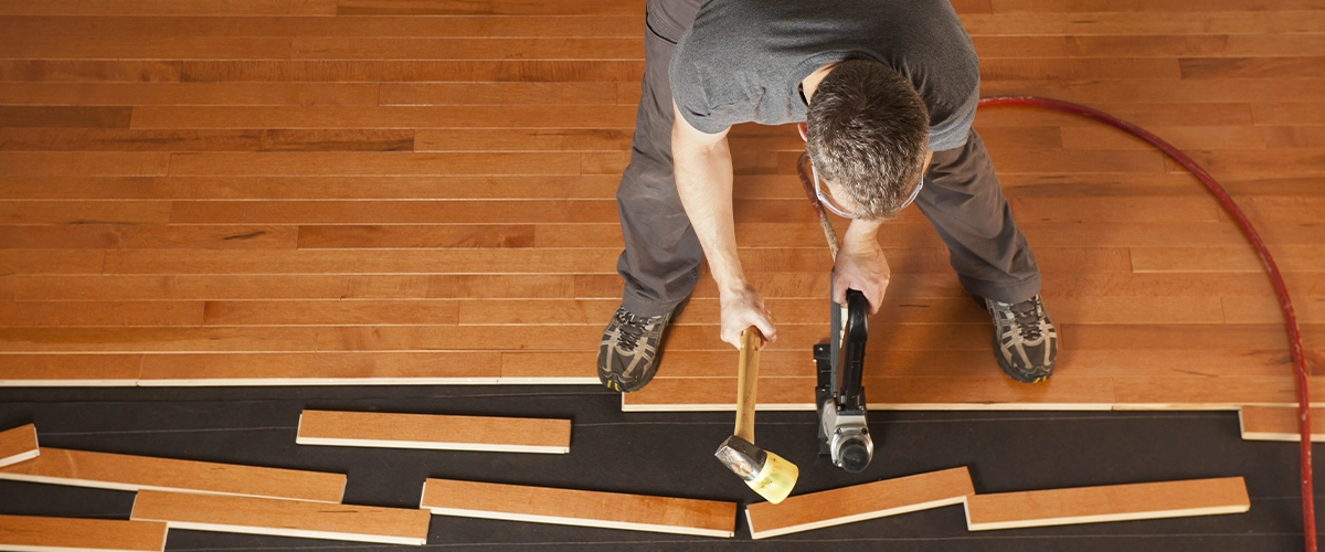Man installing prefinished hardwood floors