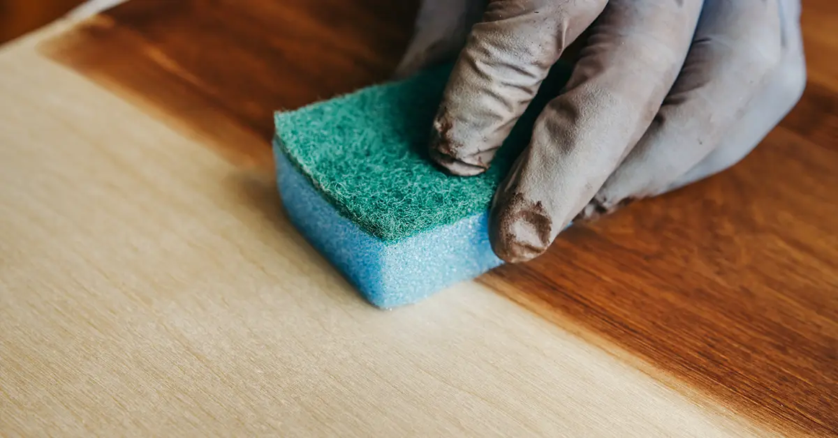 Applying stain to a light hardwood floor