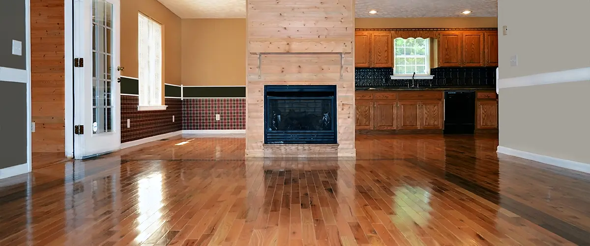 An open concept kitchen with new refinished floors