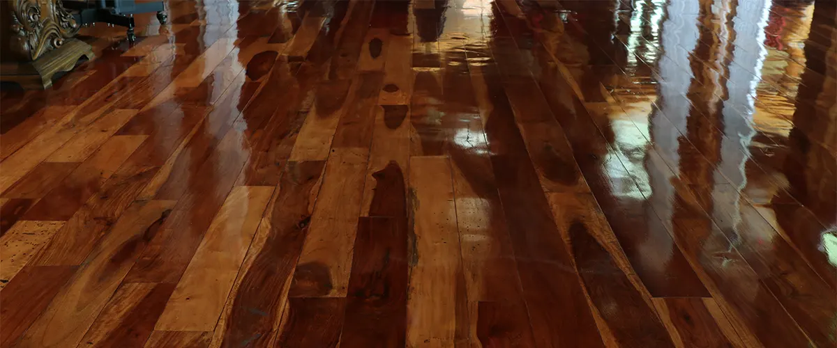 A hard was finish on a dark hardwood floor