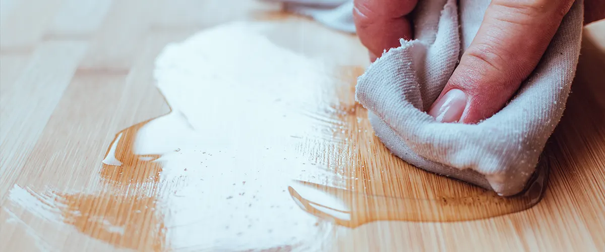 Oil finish being applied with a white cloth