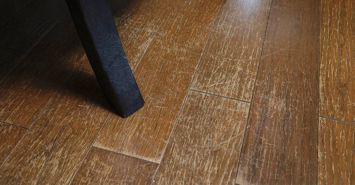 Closeup of hardwood floor with scratches