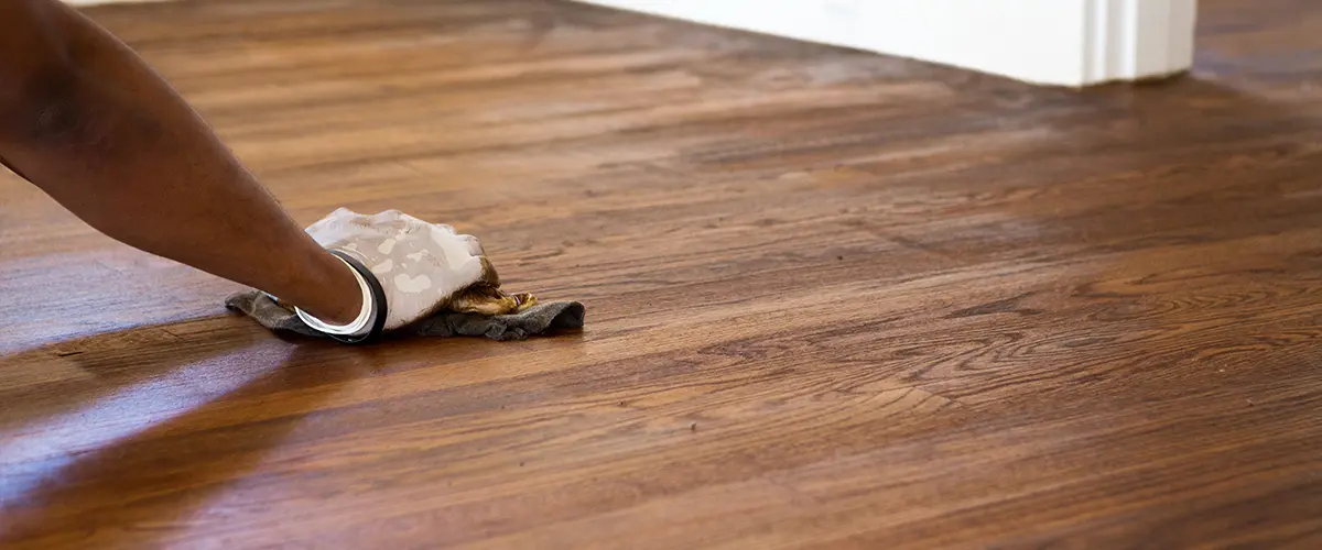 Professional floor refinishers working on a hardwood flooring