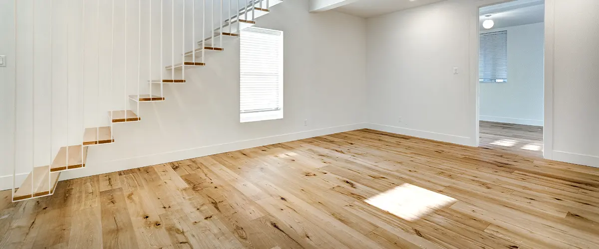 A wood floor in an empty basement