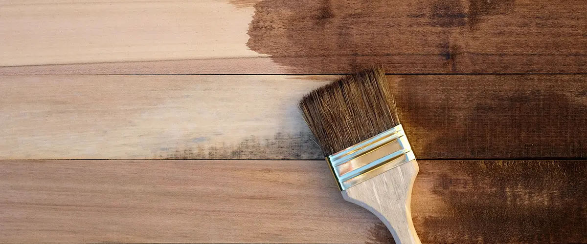 Staining a wood floor with a small brush and dark stains