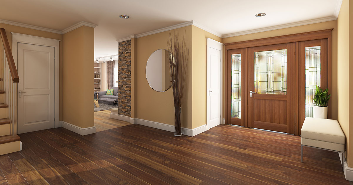 A hall and living room with hardwood flooring