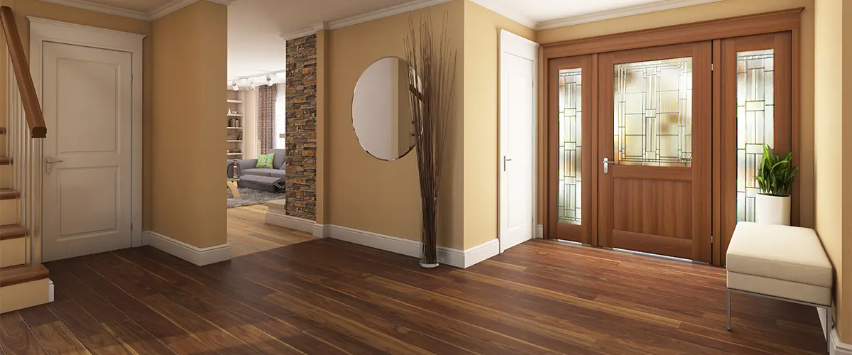 A hall and living room with hardwood flooring