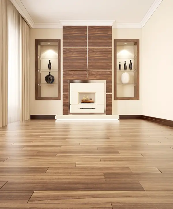 A beautiful wood floor with a fireplace in an empty room