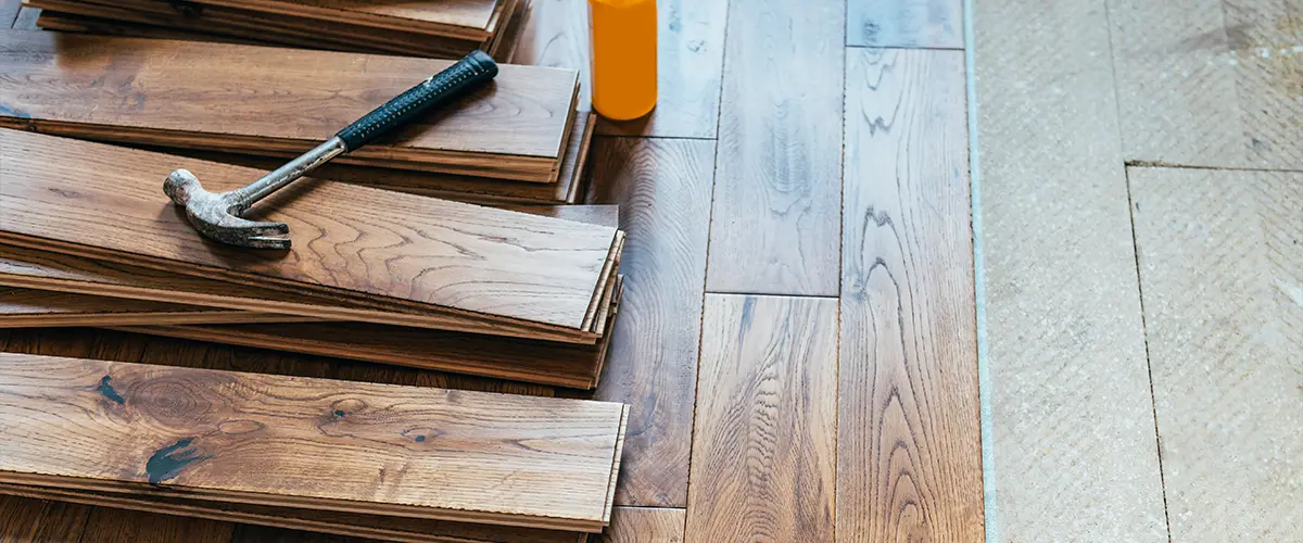 Replacing wood floors with engineered hardwood with a hammer and glue