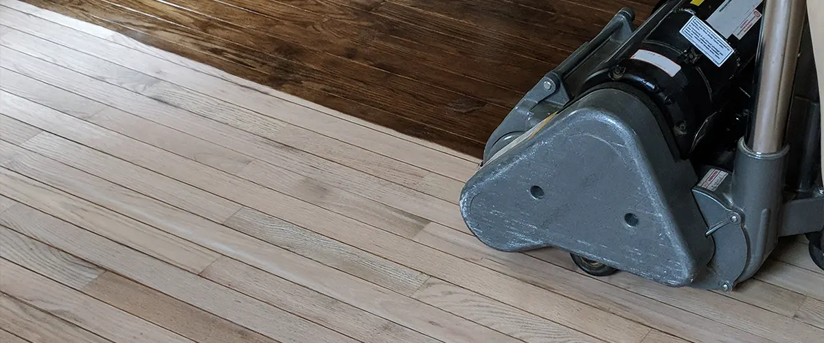 Finishing a wood floor with a heavy machine
