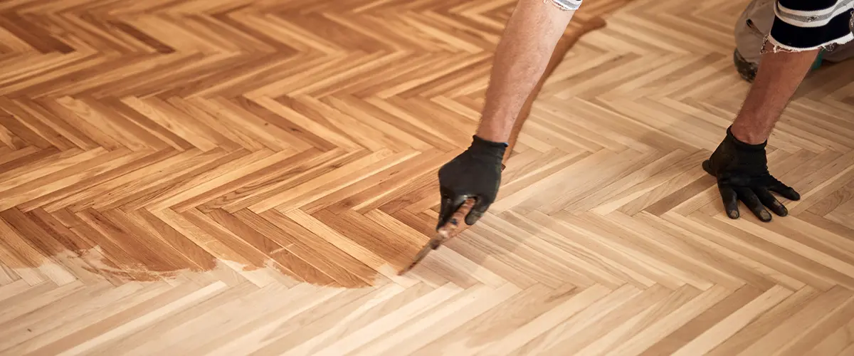 Wood flooring being stained and sealed