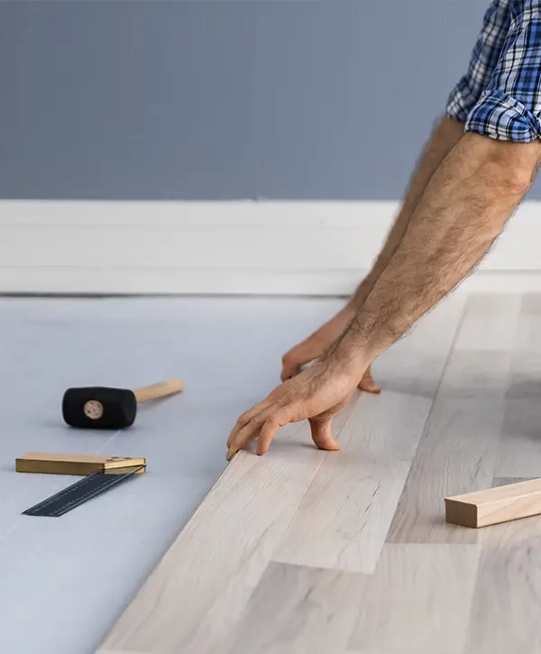 A wood flooring installation with tools