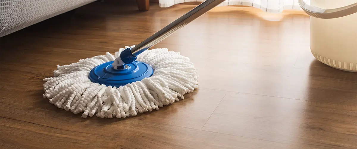 Dry mopping a luxury vinyl plank flooring