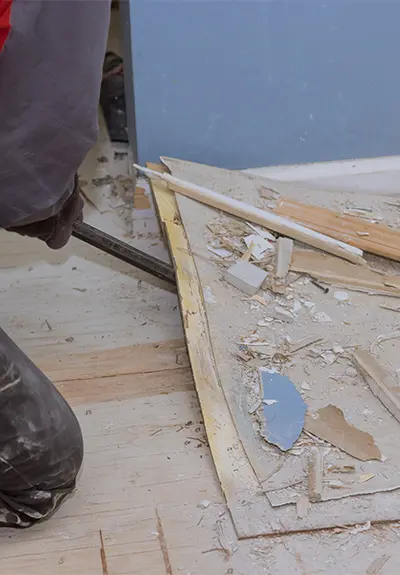 Contractor tearing wood floors apart