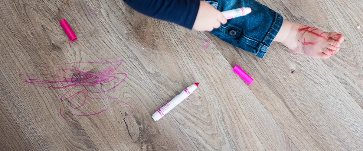 luxury vinyl plank maintenance for a floor with kid's drawings